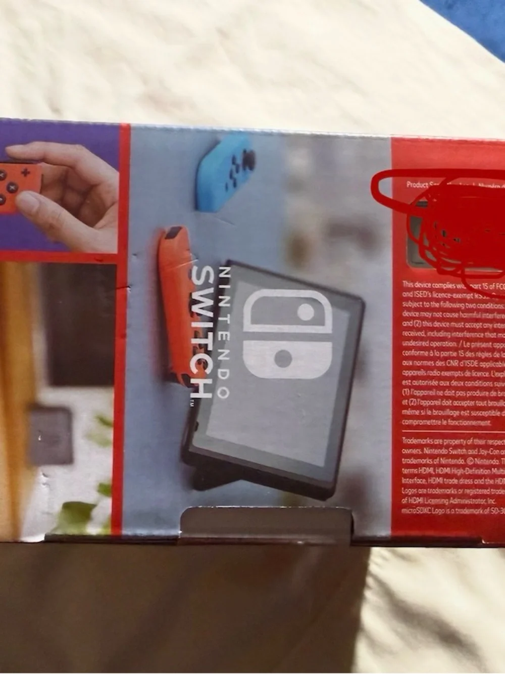 Nintendo Switch Console with Blue Left Joy-Con and Red Right Joy-Con